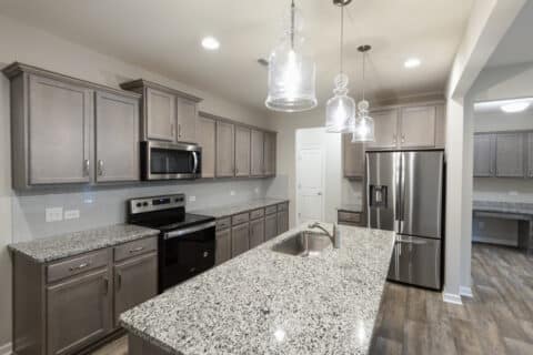 kitchen with stone countertops and a stone countertop island
